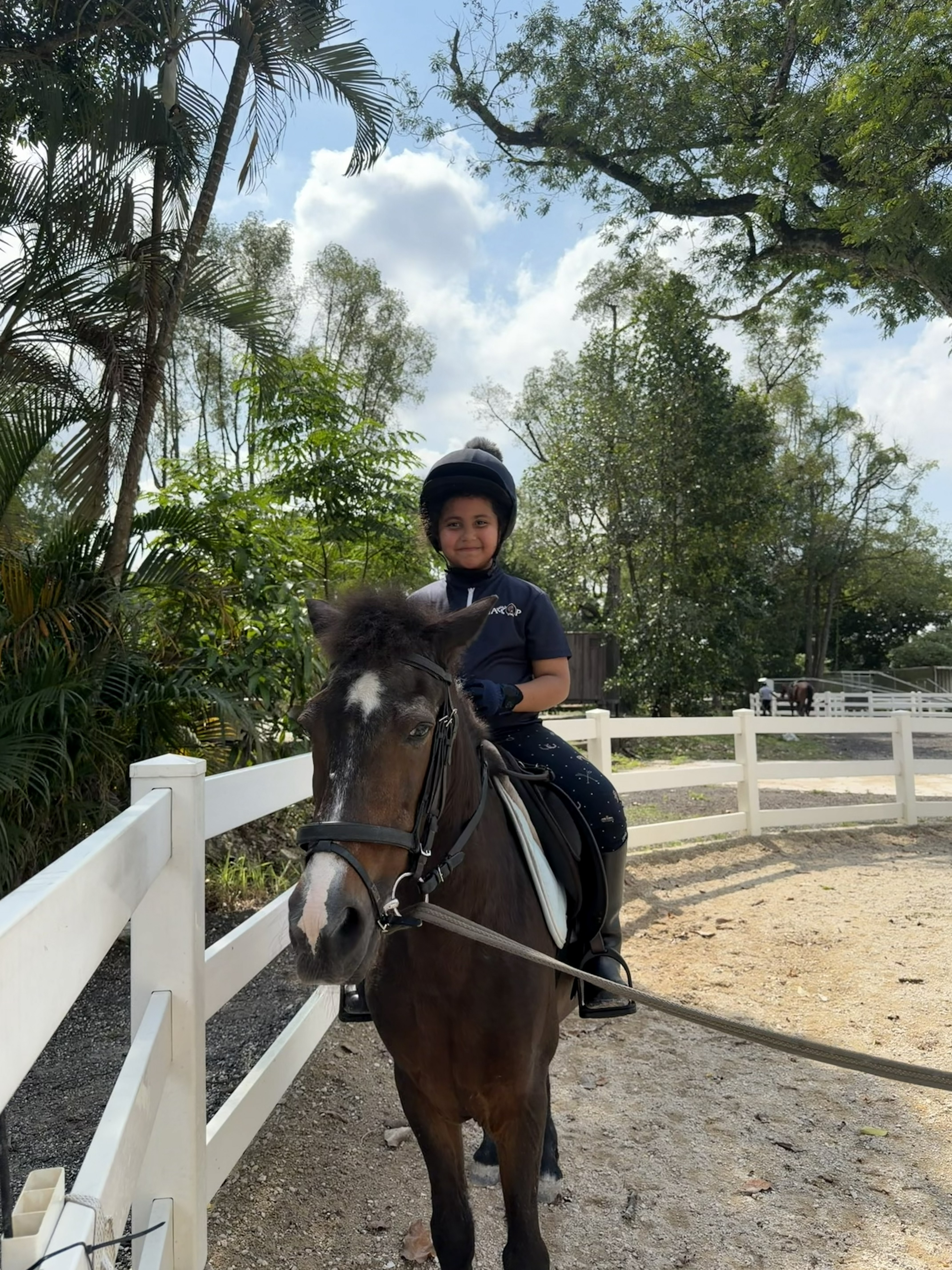 A participant enjoying time with a Gallop Stable horse